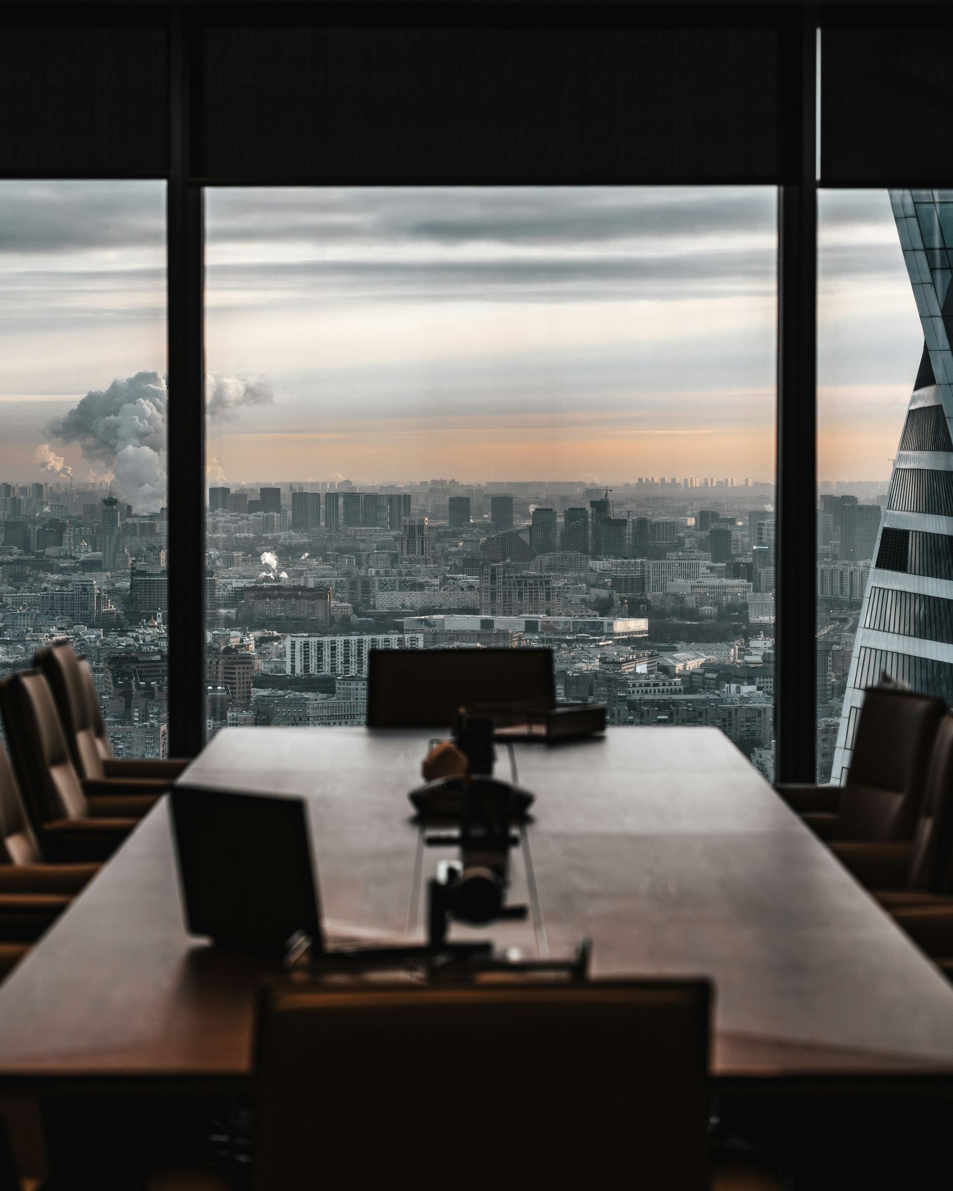 Boardroom overlooking the city at dusk