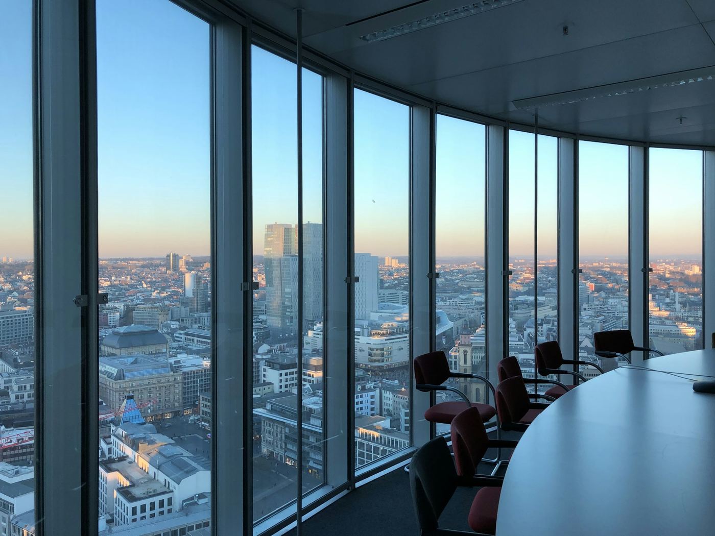 Executive team meeting in a glass-walled boardroom