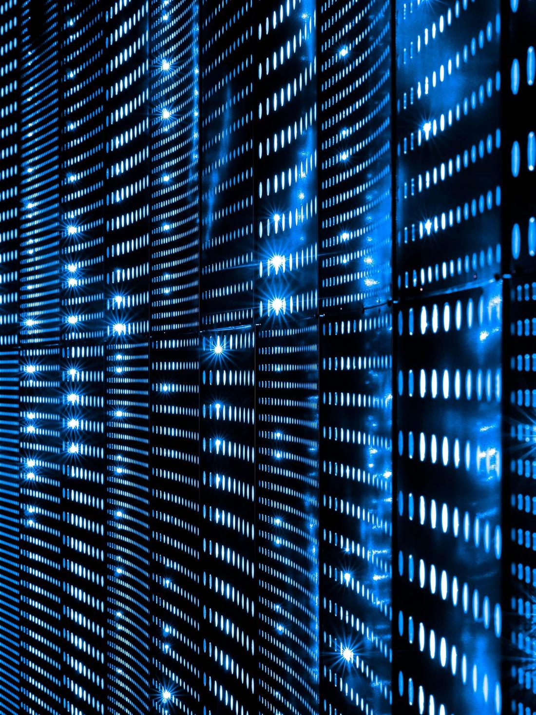 Server rack status lights in a darkened data centre