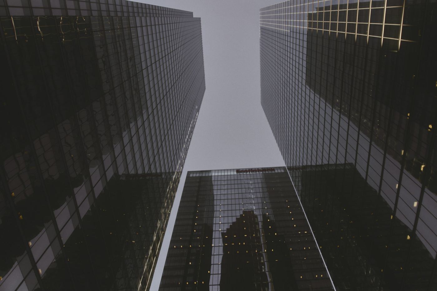 Looking up between glass towers in the financial district